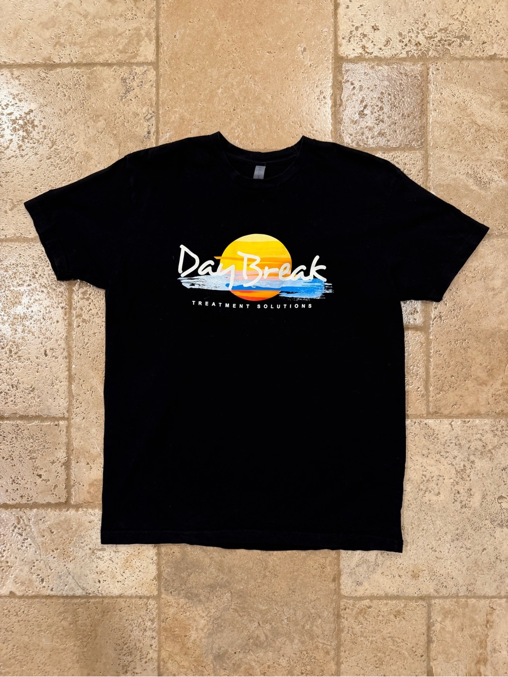 Next Level Appearl “Day Break” Treatment Solutions Black Tee